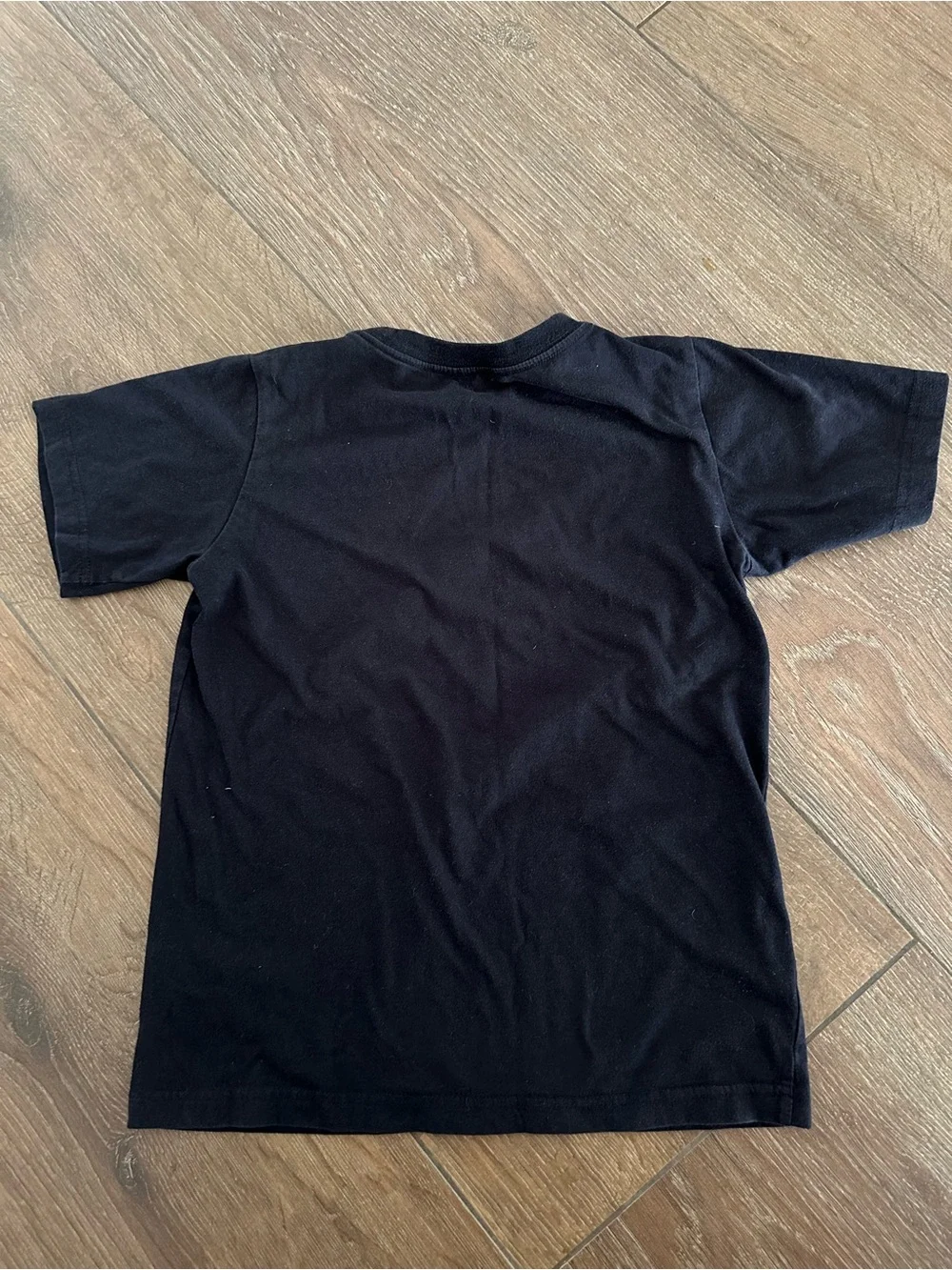 Nike AIR boys Black Tee with White Jumpman and Pink AIR Lettering. Size S.